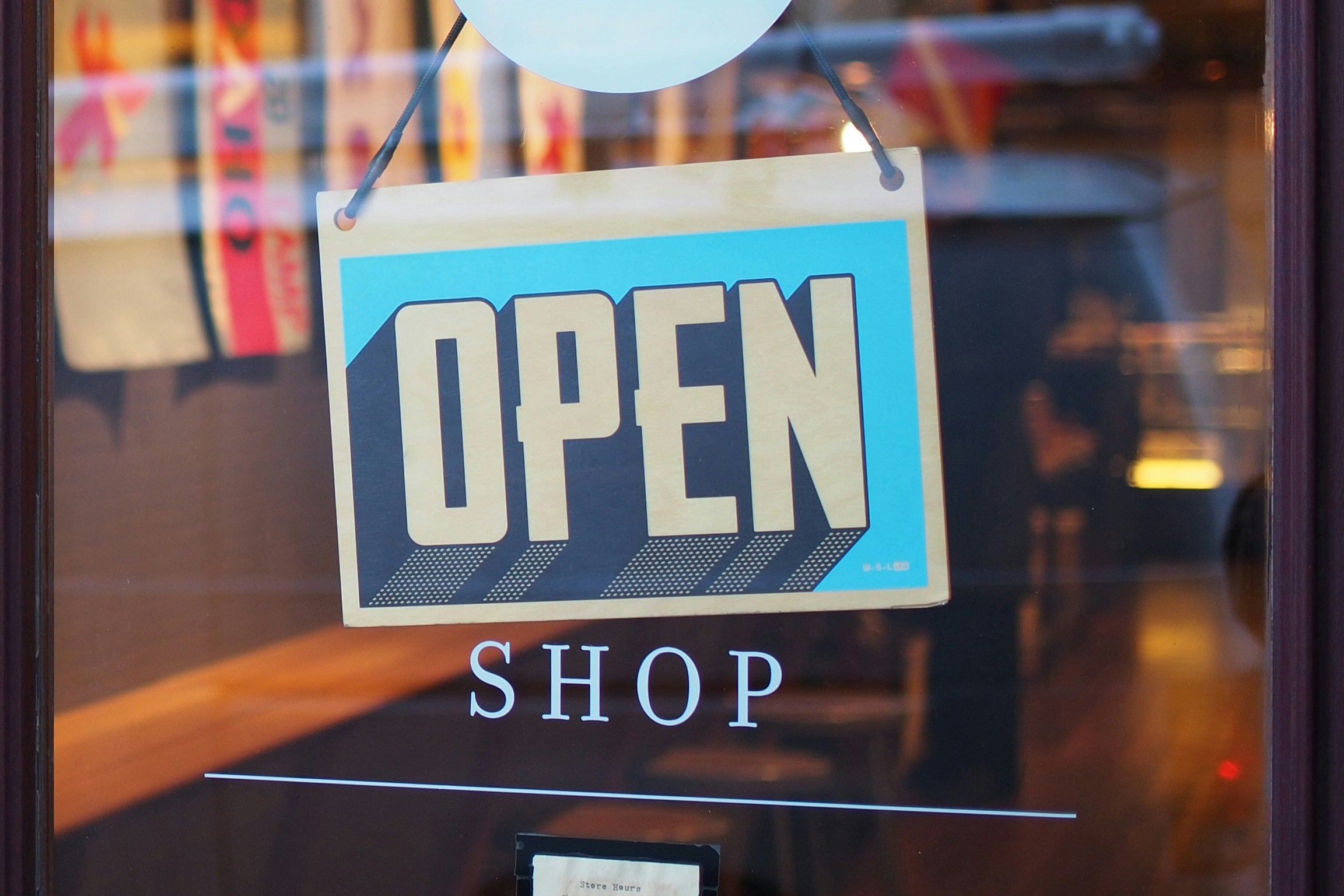 open sign on the front of a shop